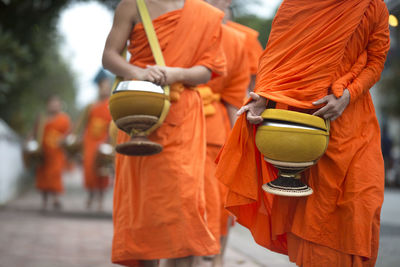 Rear view of people walking in temple