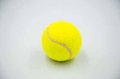 High angle view of yellow ball on white background