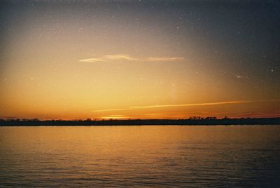 Scenic view of sea against sky at night