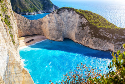 Scenic view of sea seen through rocks