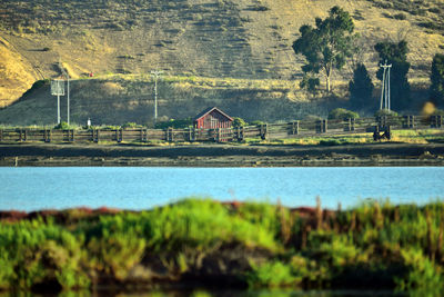 Scenic view of lake by building