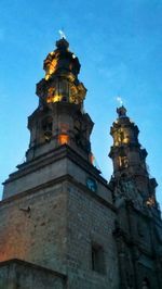 Low angle view of church against blue sky