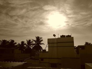 Low angle view of building against cloudy sky