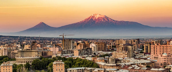 High angle view of city buildings during sunset