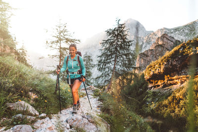 Rear view of man standing on mountain