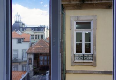 Residential buildings seen through glass window