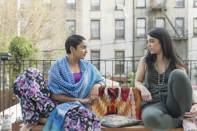 Young women talking at a party