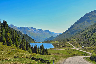 Scenic view of mountains against clear blue sky