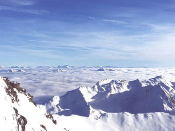 Scenic view of snowcapped mountains against sky