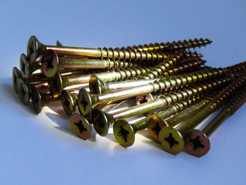 Close-up of objects on table against blue background