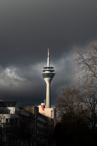 Low angle view of rheinturm against sky