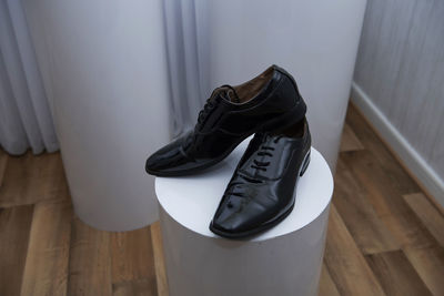 High angle view of shoes on hardwood floor