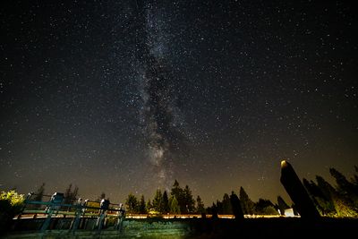 Scenic view of lake against star field at night milky-way in the harz mountains 