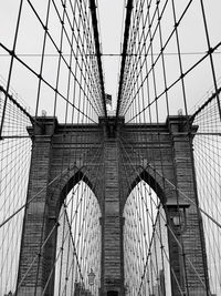 Low angle view of brooklyn bridge against sky