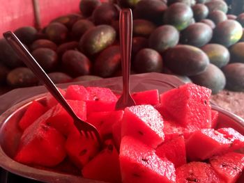 Close-up of watermelon slices in plate at market stall