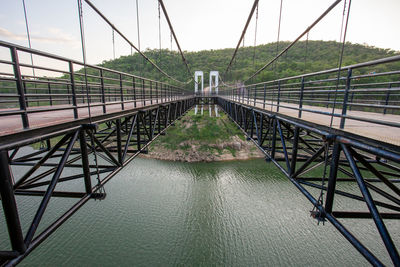 Bridge over river against sky