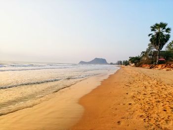 Scenic view of beach against clear sky