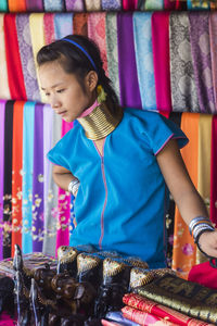 Woman standing at market stall