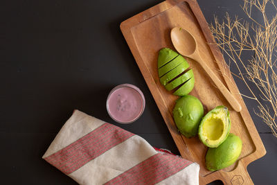 High angle view of fruits on cutting board