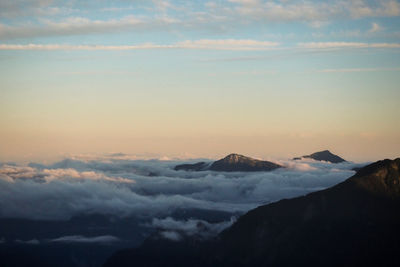 Scenic view of mountains against sky during sunset