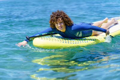 Woman swimming in sea