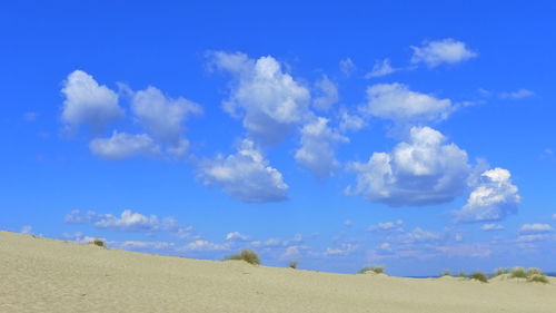 Low angle view of clouds over blue sky