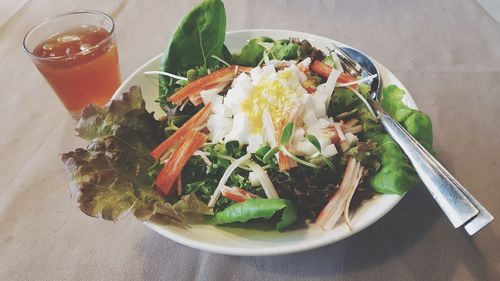 High angle view of salad in bowl on table