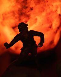 Silhouette of woman at sunset