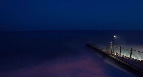 Scenic view of sea against blue sky