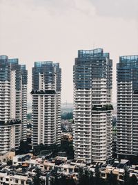 Buildings in city against sky