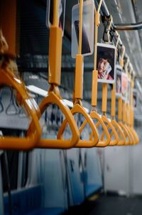 Close-up of grab handle commuter train