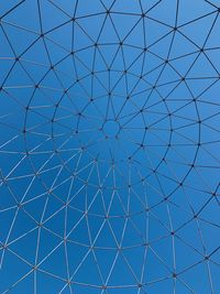 Low angle view of skylight against blue sky