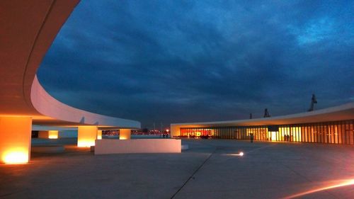 Illuminated building against the sky