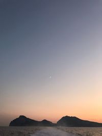 Scenic view of sea against clear sky during sunset