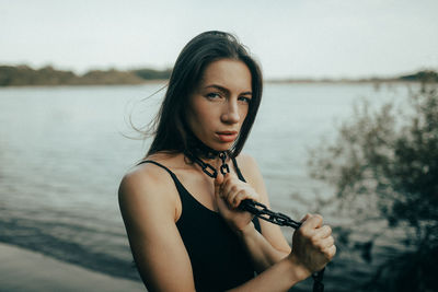 Portrait of smiling young woman looking away