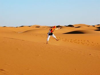 Full length of woman in desert