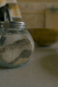 Close-up of glass jar on table