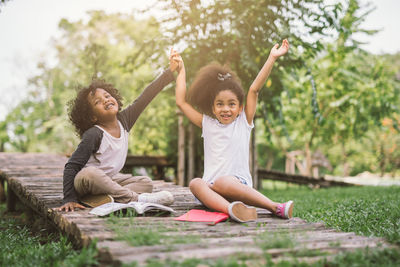 Happy girl and women in park