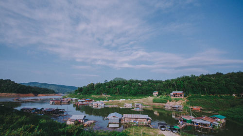 High angle view of boats moored in lake against sky