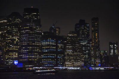 Illuminated buildings in city at night