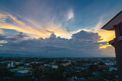 High angle shot of townscape against sky at sunset