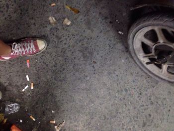 Low section of shoes on road