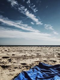 View of calm beach against the sky