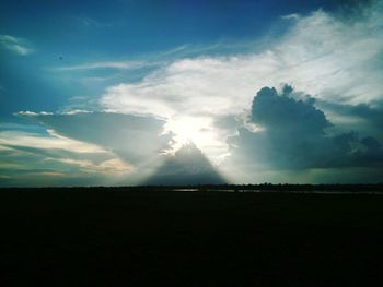 Scenic view of silhouette field against sky