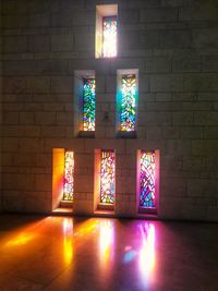 Illuminated light painting on wall