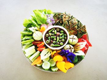 High angle view of chopped fruits in bowl on table