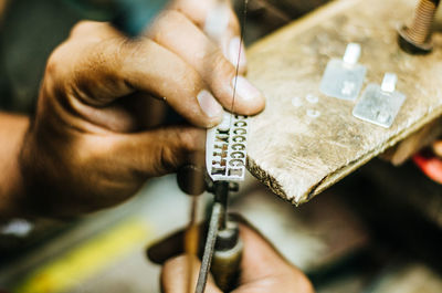 Close-up of jeweller working in workshop