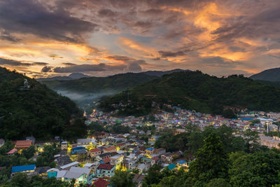 High angle view of townscape against sky during sunset
