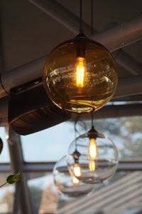 Low angle view of illuminated light bulb