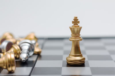 Close-up of chess pieces against white background